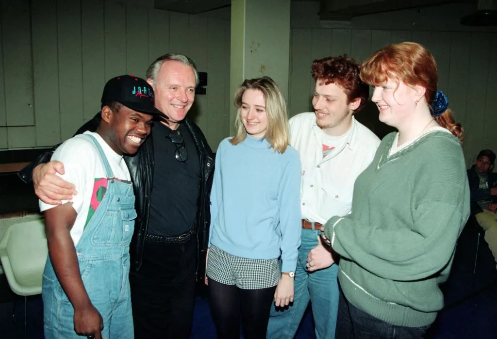 Anthony Hopkins hugs an acting student.