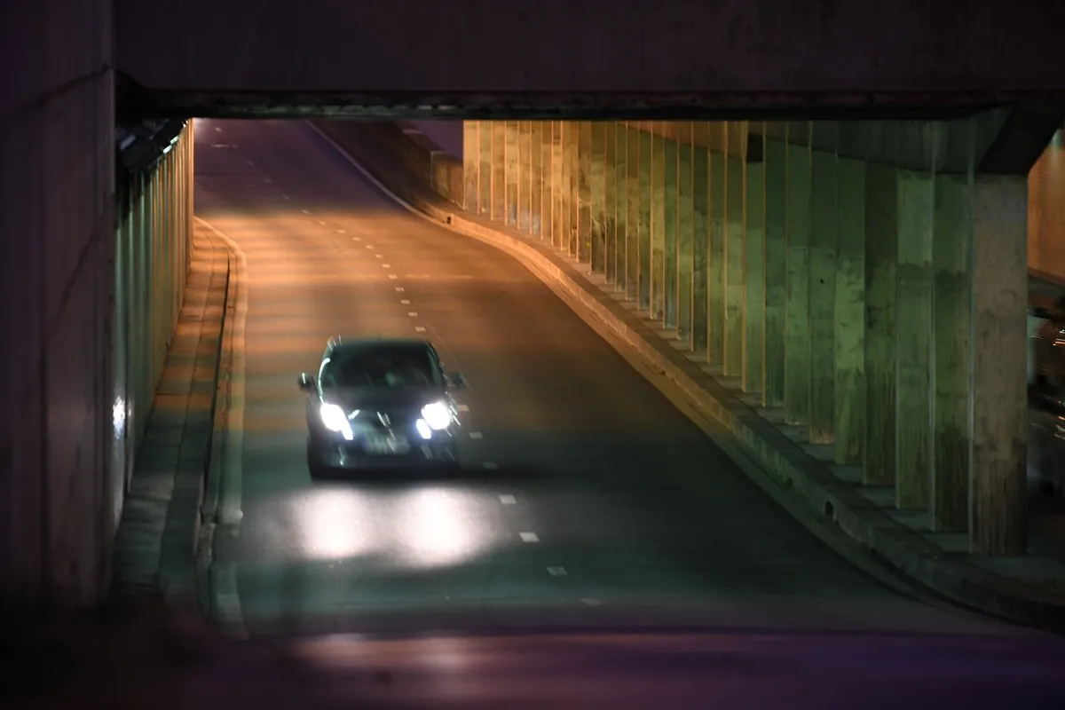 A car is seen driving through the Alma tunnel bridge, where Princess Diana's car crashed.