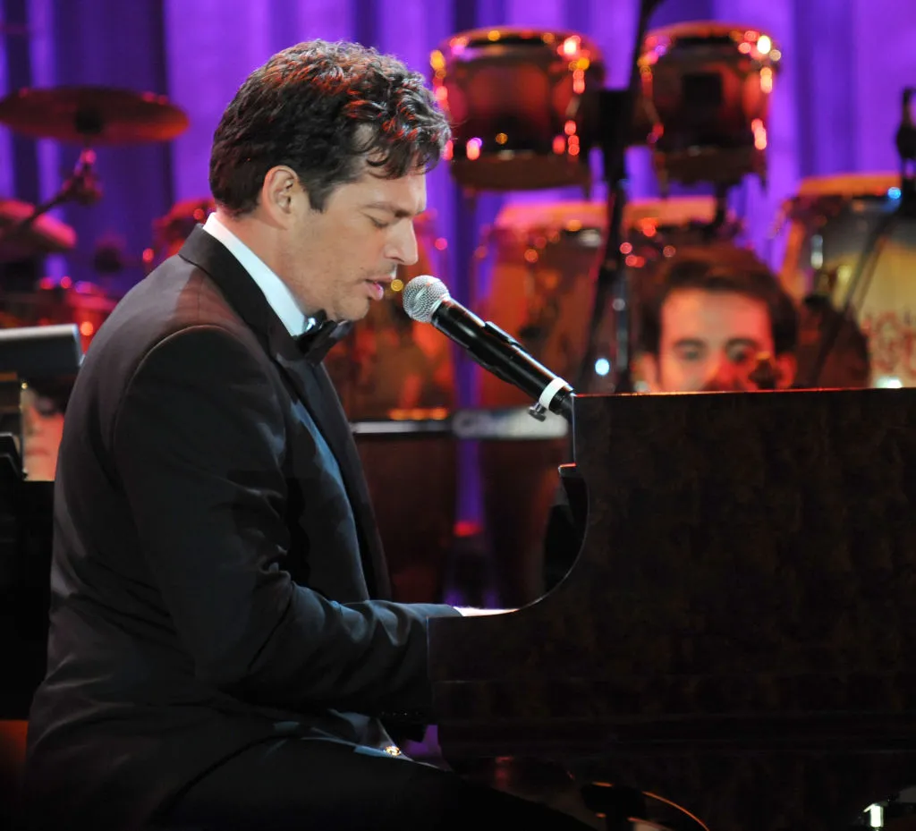 Harry Connick Jr. sings and play piano onstage.