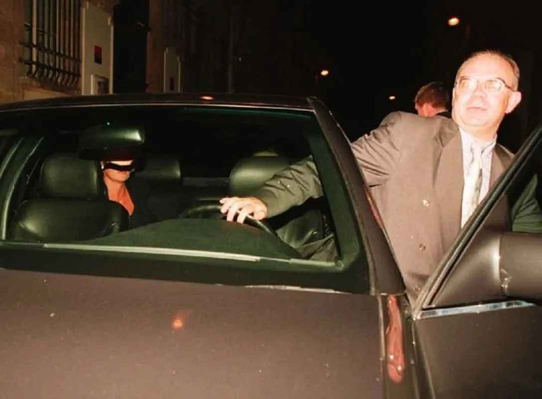 Henri Paul, Diana's driver, faces the paparazzi before he embarks.