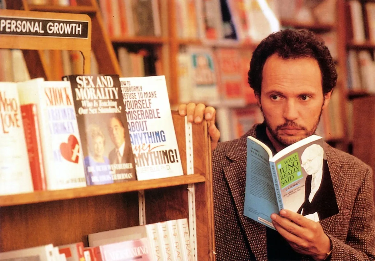 Harry reads a book in a bookstore.