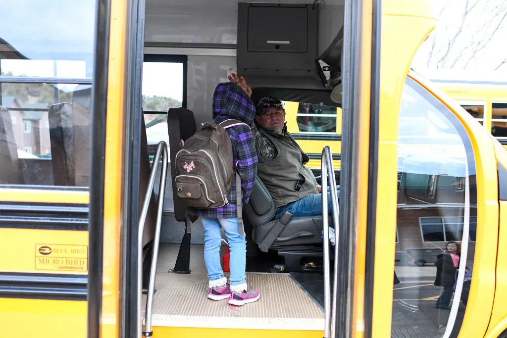 school bus driver with a student