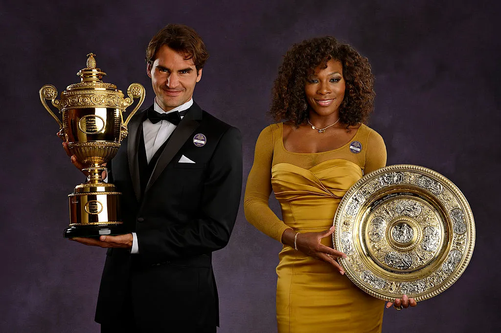 Serena Williams and Roger Federer pose with their Wimbledon trophies.