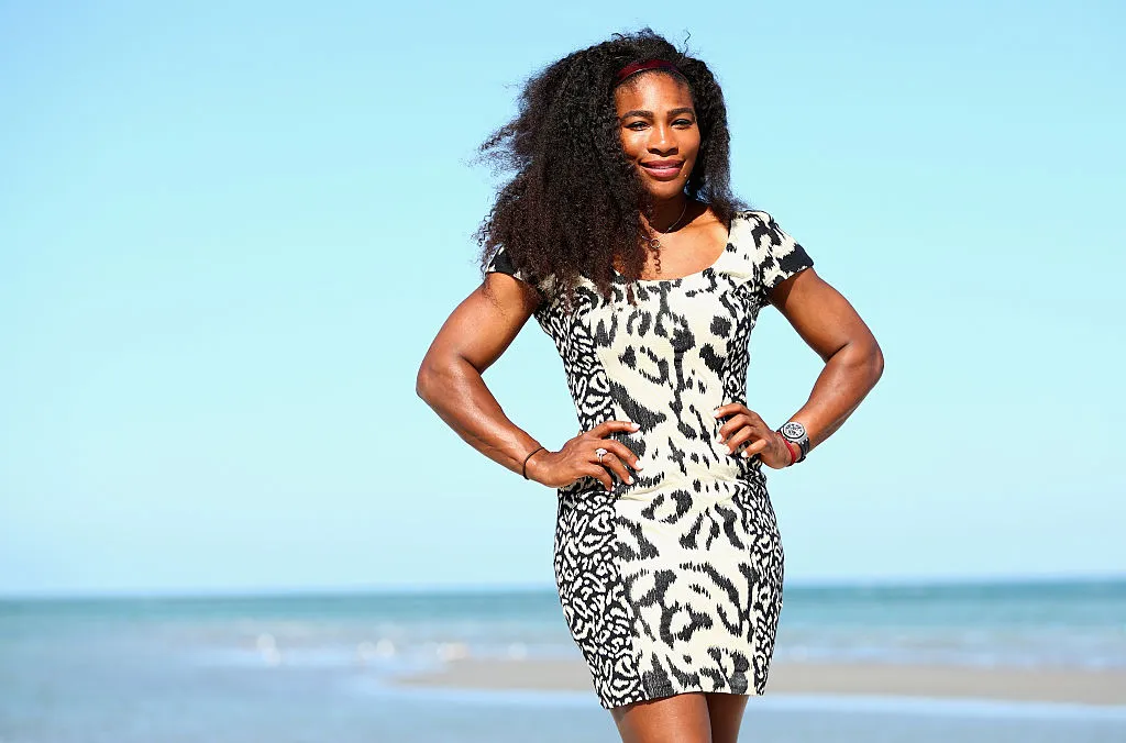 Serena wears a cheetah-print dress on the beach.