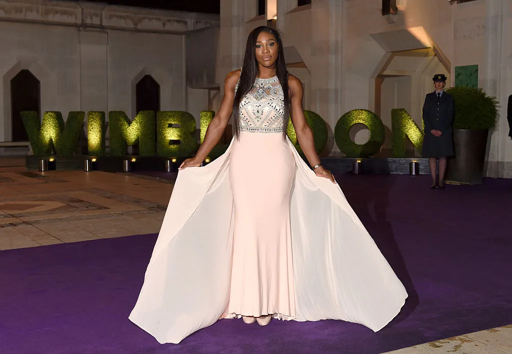 Serena poses in a London courtyard wearing a glamorous gown.