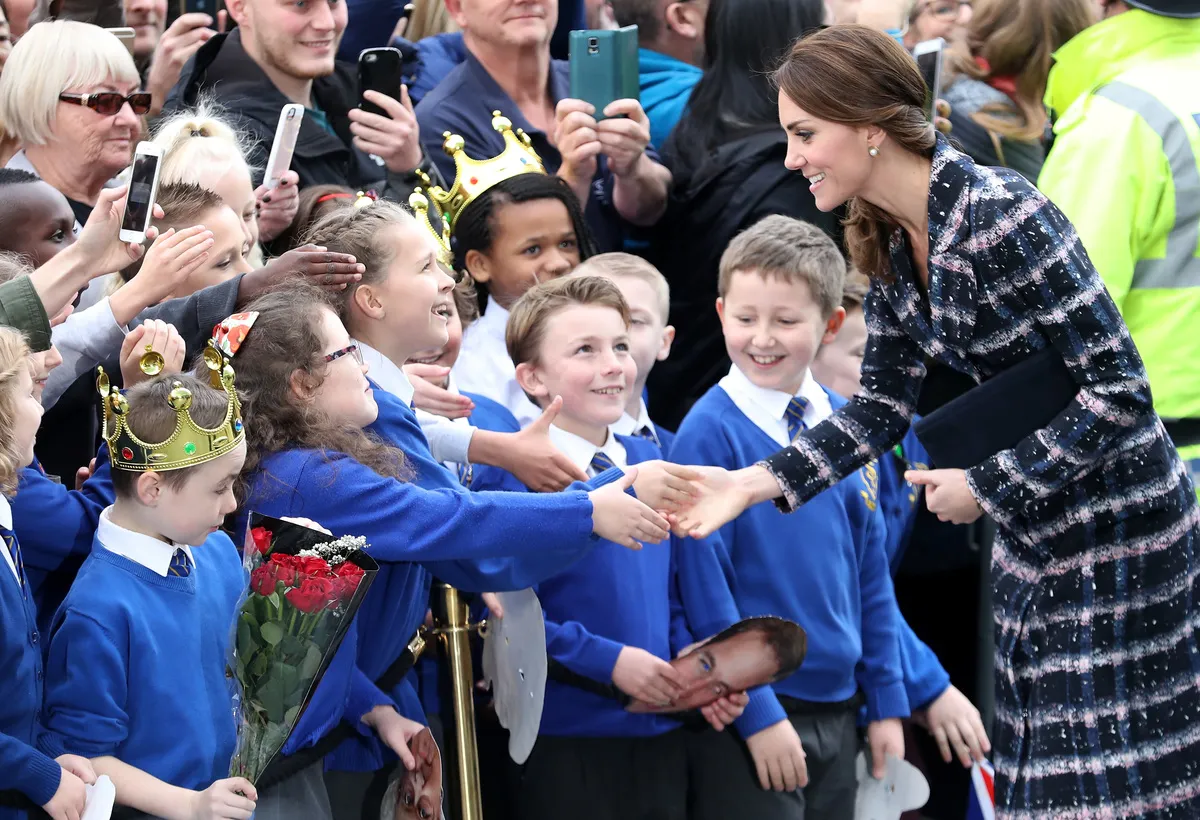 Catherine, Duchess of Cambridge meets children from St Philips school.