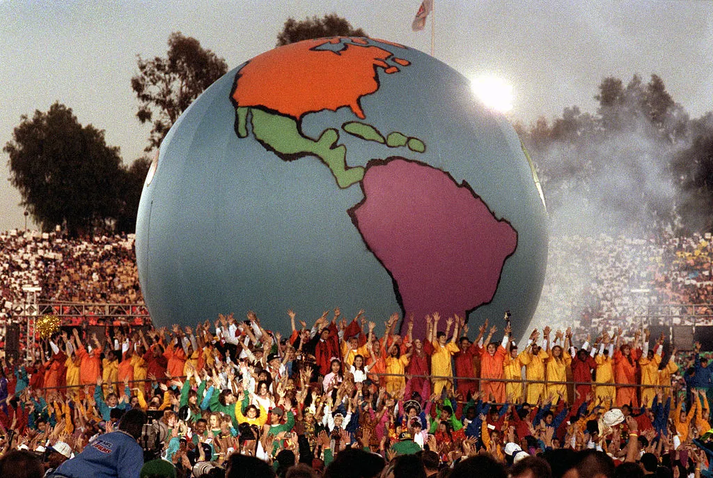 A giant model of the world rests amongst Heal the World performers during the 1993 Super Bowl.
