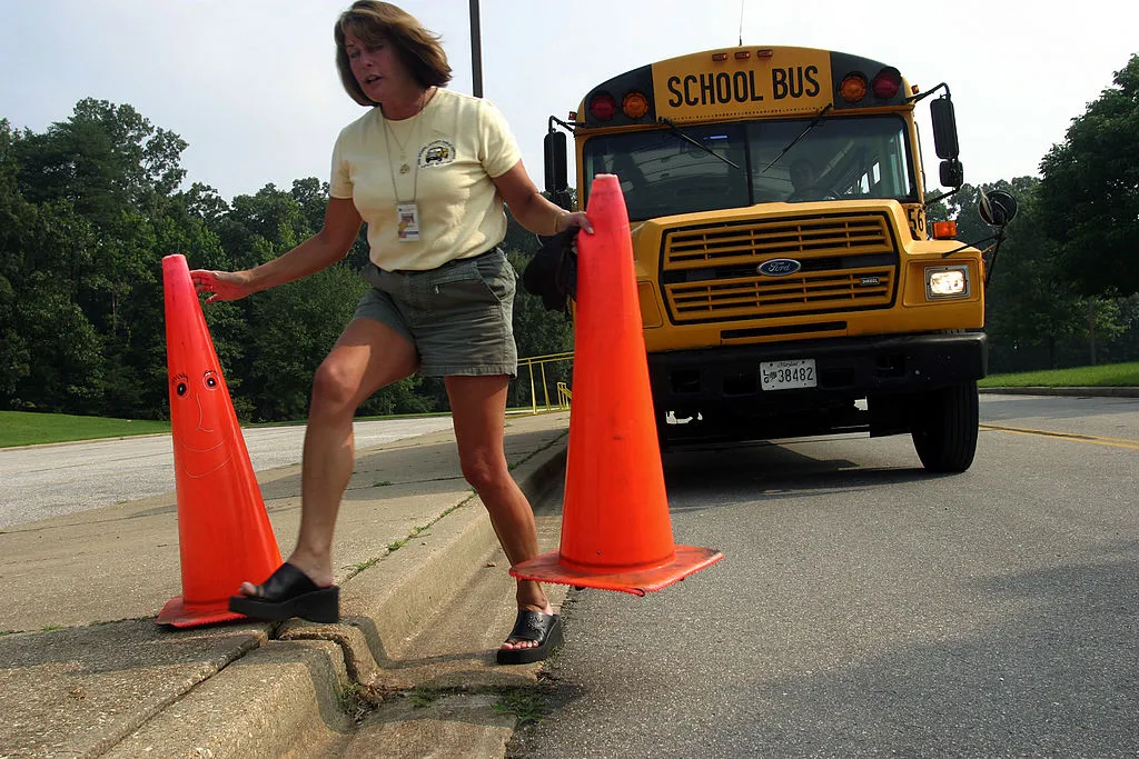 a bus driver putting out safety cones