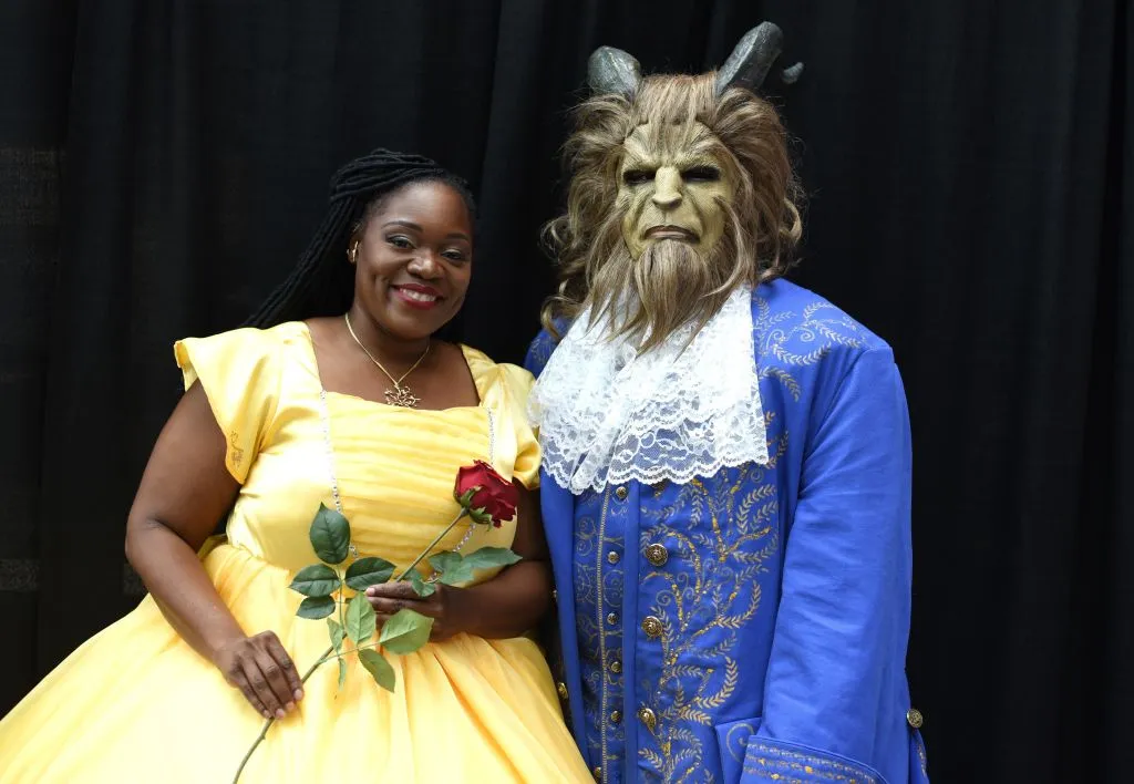 a couple dressed as belle and the beast from beauty and the beast