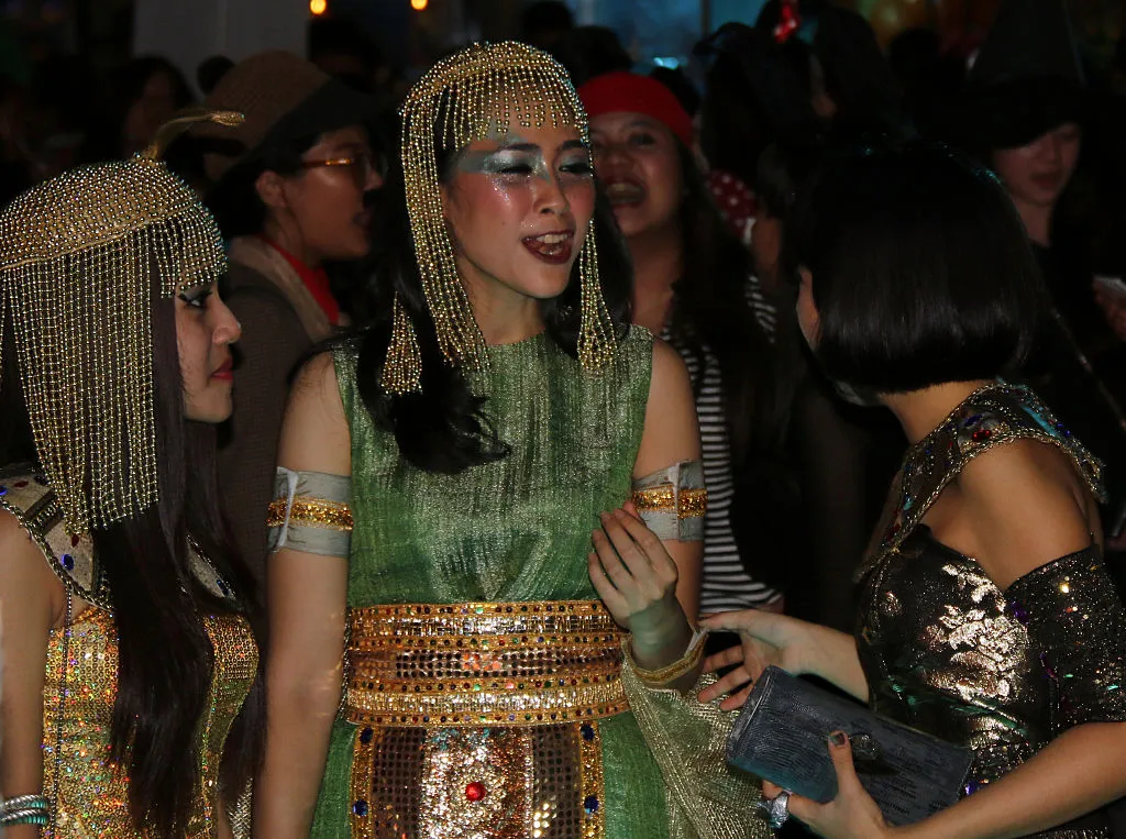 a couple women dressed as cleopatra