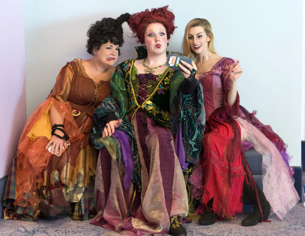 three women dressed as the sanderson sisters from hocus pocus