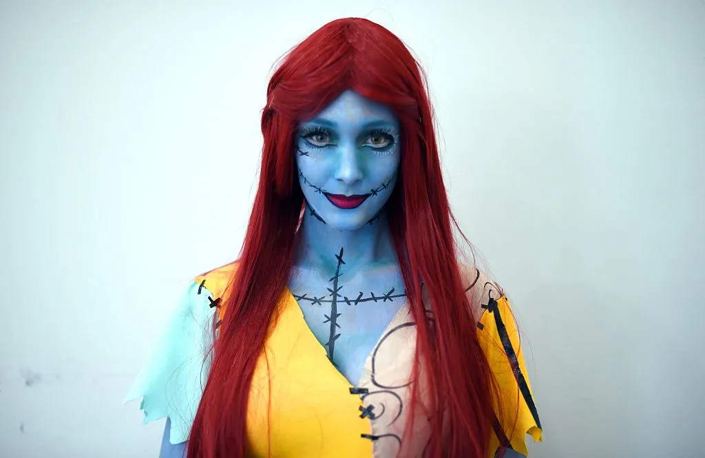 a woman dressed as sally from the nightmare before christmas