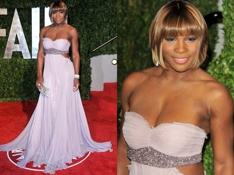 Serena Williams wears a short, blonde bob and a long, strapless, lavender gown.