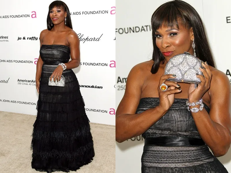 Serena shows off her jeweled clutch while wearing a black gown.
