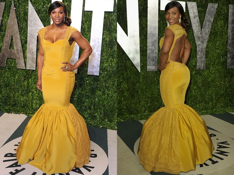 Serena wears a form-fitting, yellow gown at a Vanity Fair event.
