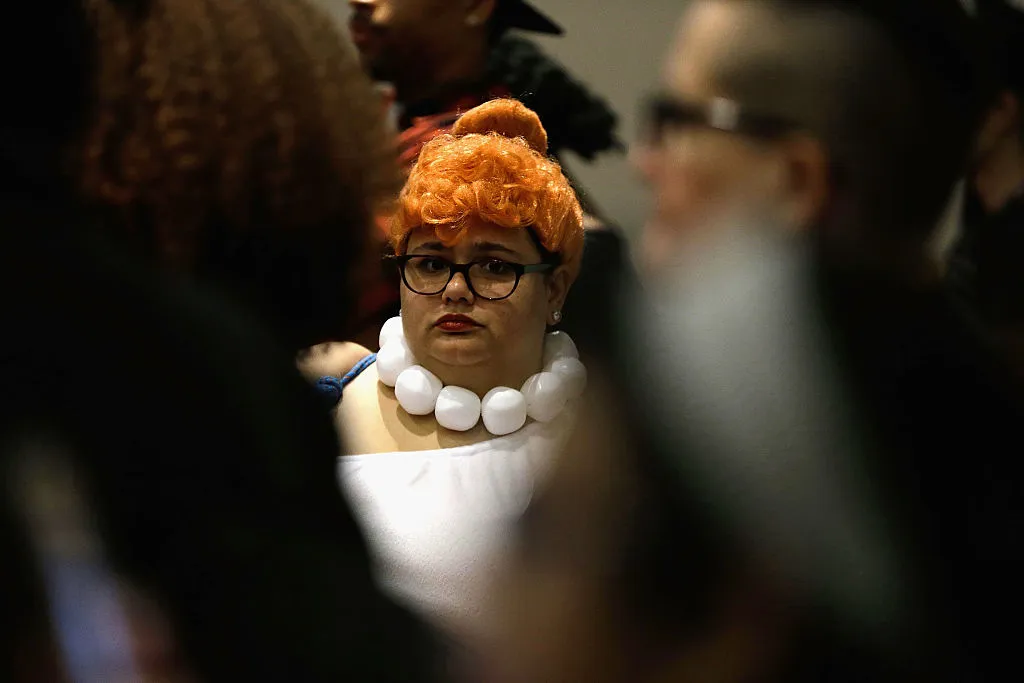 a woman dressed as wilma from the flintstones