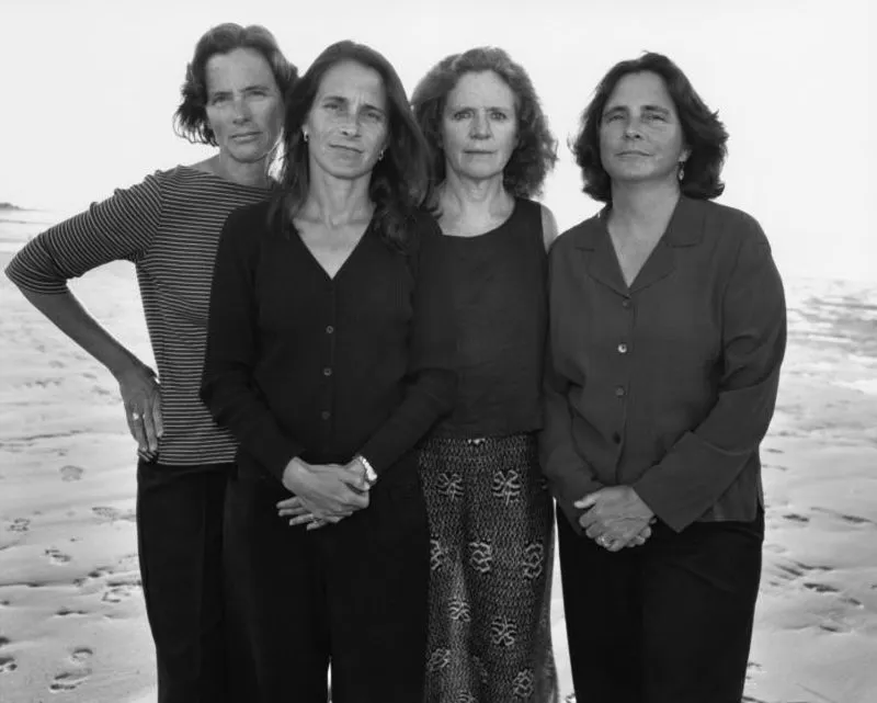 four sisters posed together