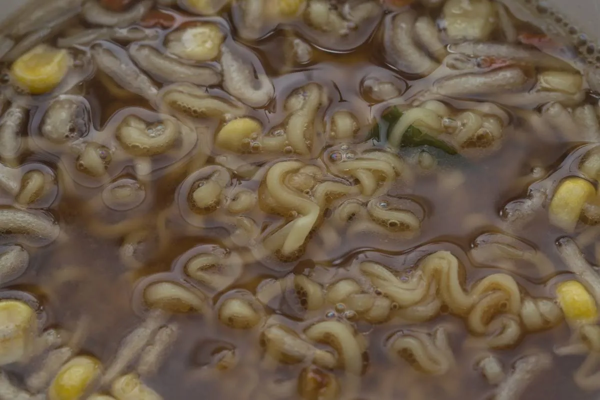 A close-up shows cooked miso instant ramen.