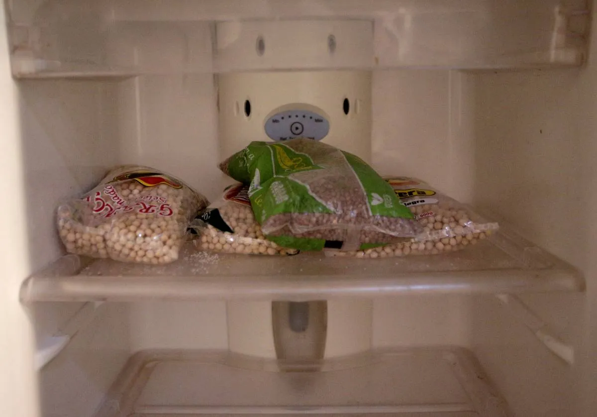 Bags of lentils and chickpeas sit in the pantry.