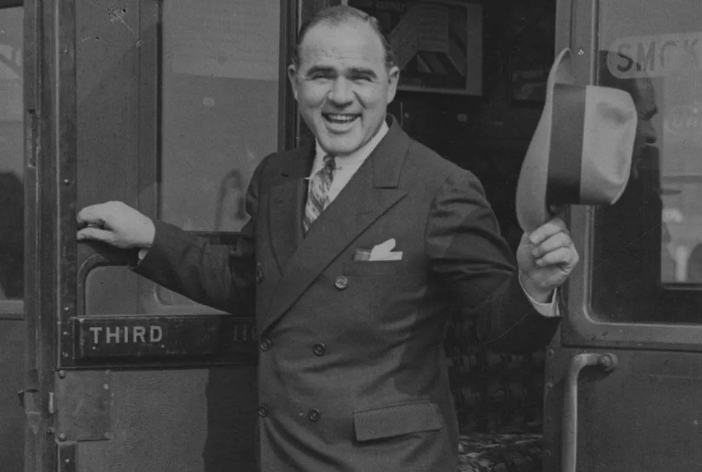 Hal Roach getting off a train