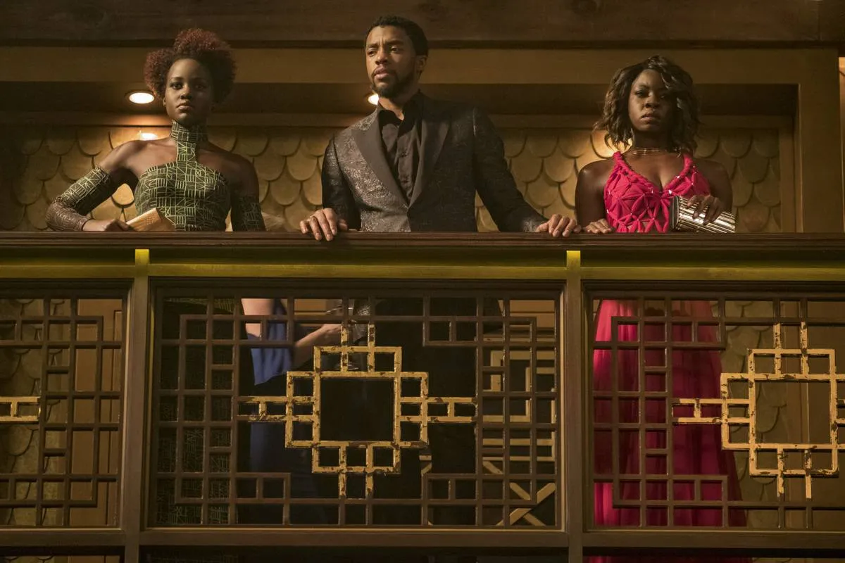 Okoye, T'Challa, And Nakia Are Dressed In Pan-African Flag Colors