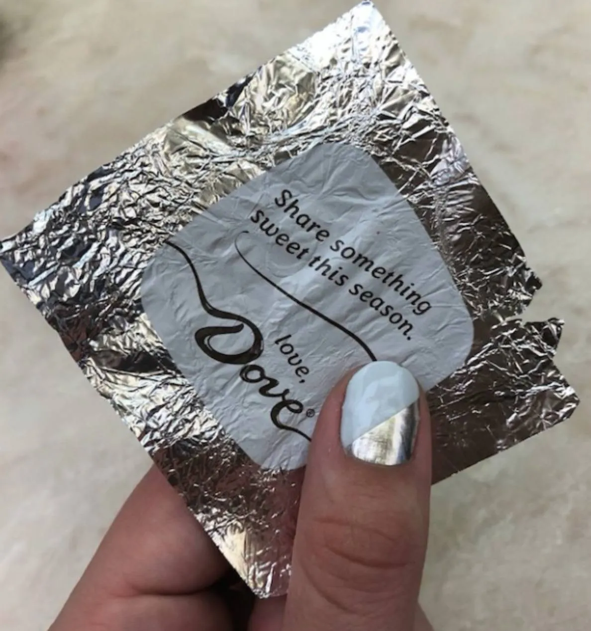 girl's nail matches chocolate wrapper