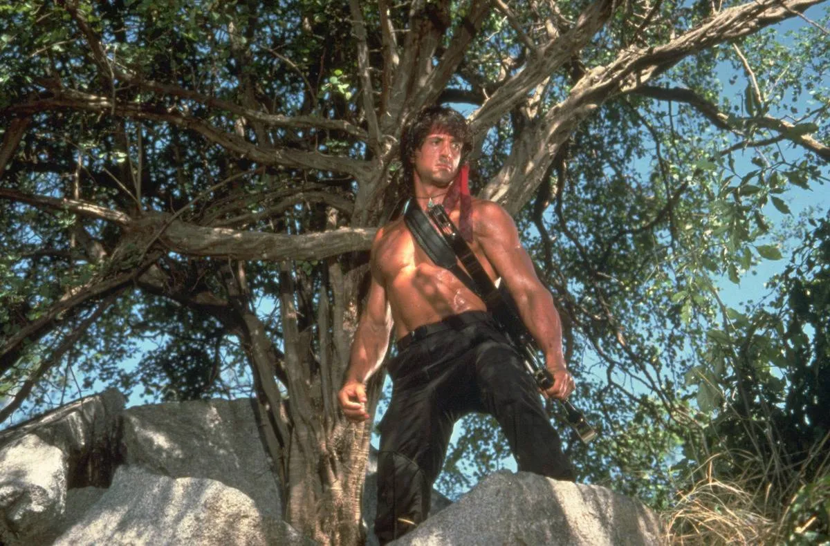 Rambo standing on a rock 