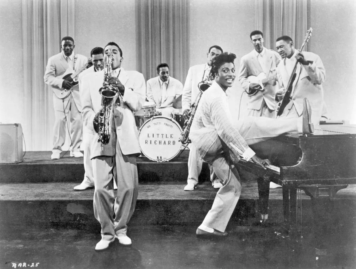 Musicians Little Richard (at the piano) and his saxophone player Grady Gaines perform in a scene from the movie 