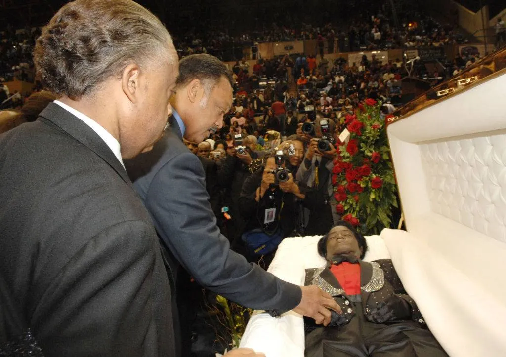 Rev. Al Sharpton and Rev. Jesse Jackson pay their respects to the late James Brown 