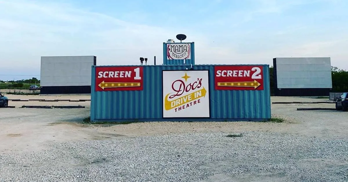 doc's drive-in theatre sign with two screens on each side