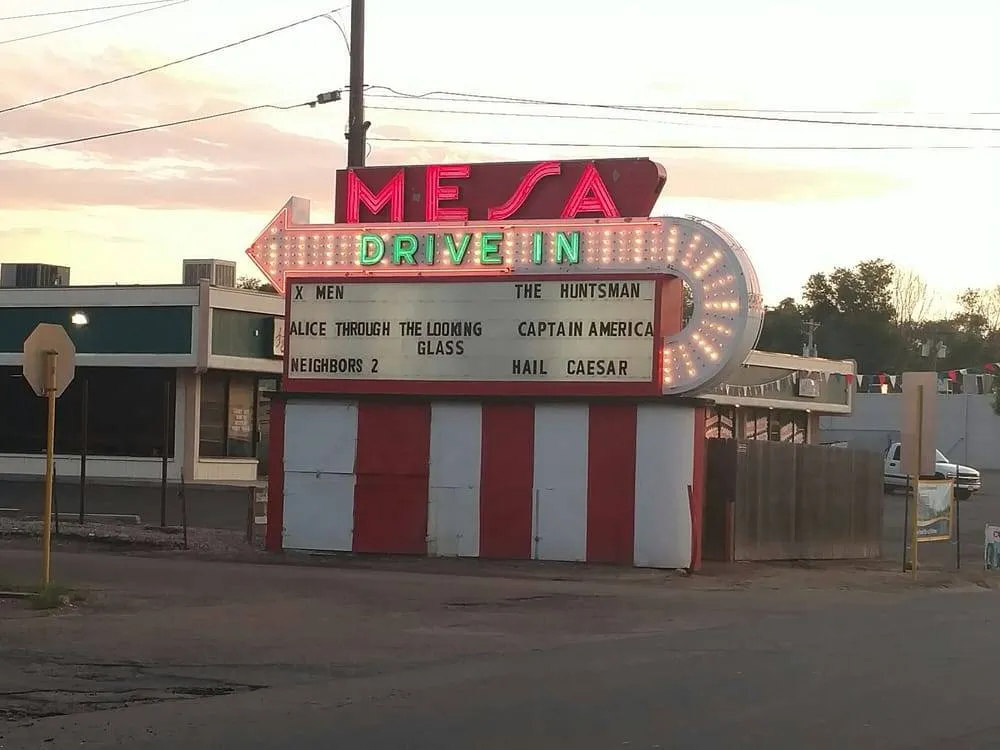 a neon sign for mesa drive in