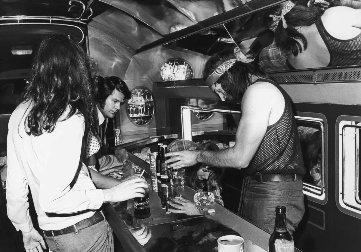 Led Zeppelin band hangs out on the Boeing 720b.
