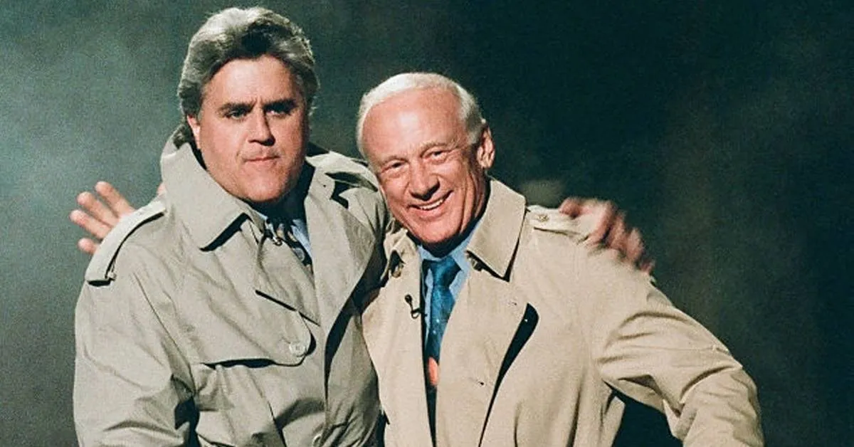 buzz aldrin and jay leno wearing trenchcoats