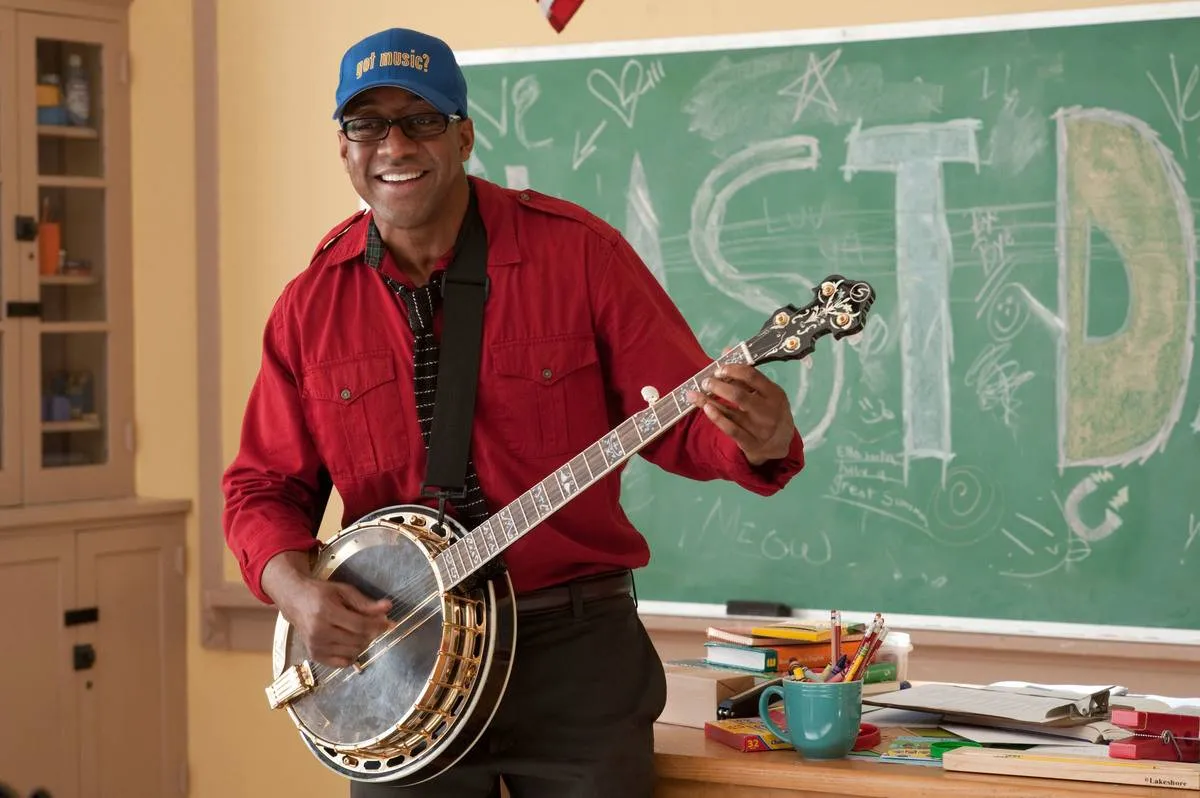 Jaleel White playing a banjo in a classroom in judy moody and the not bummer summer