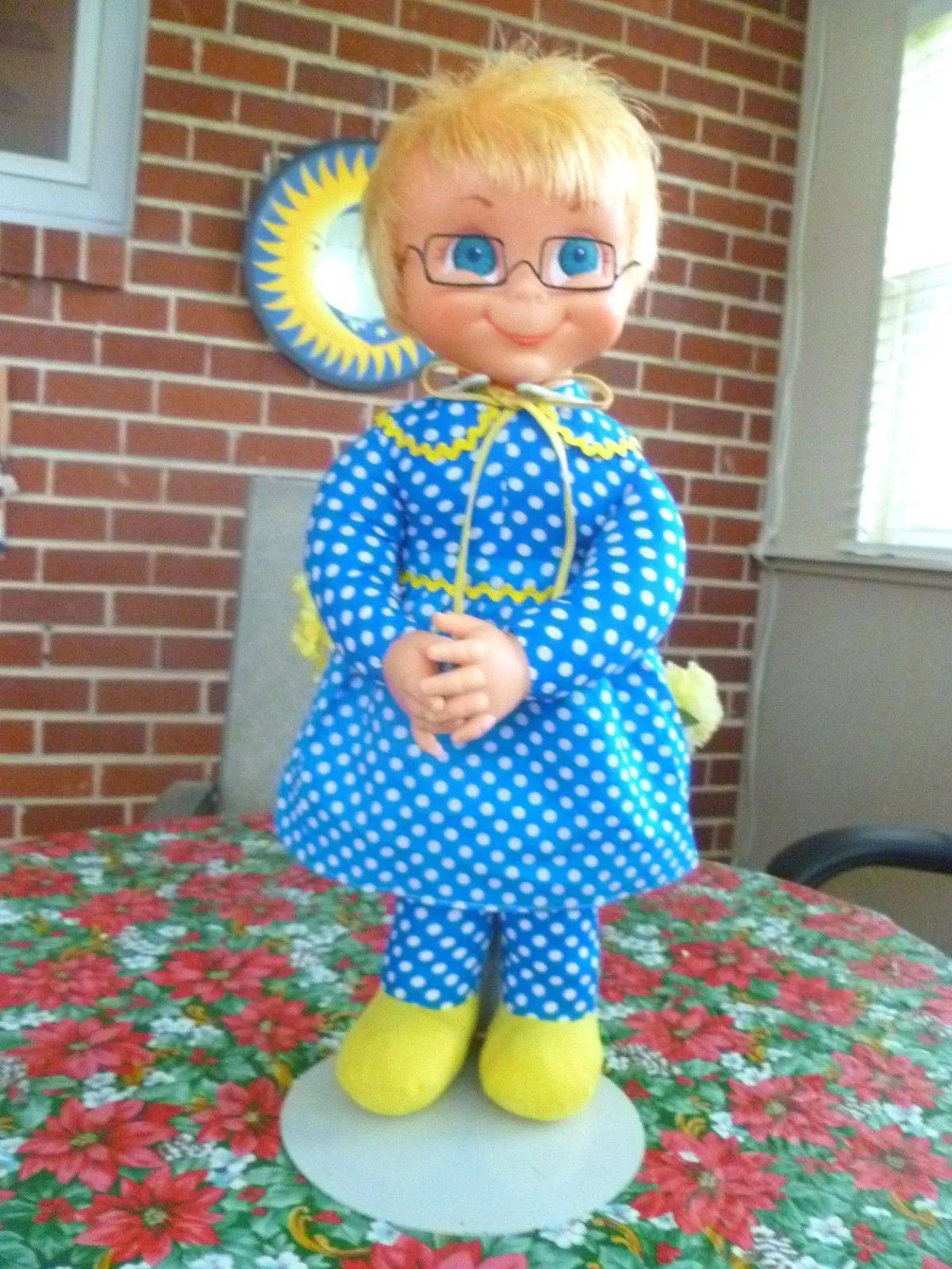 A Mrs. Beasley doll stands on a table.
