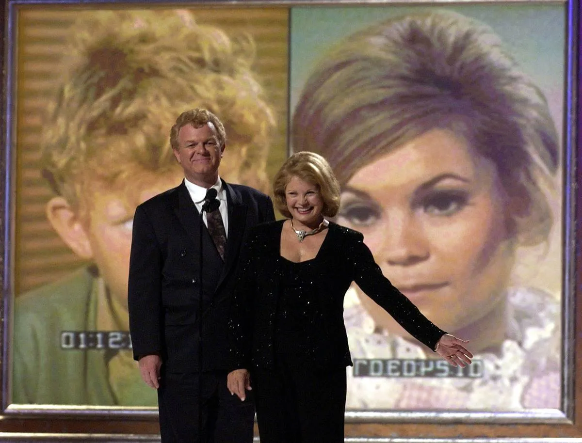 The surviving cast members of Family Affair, Johnny Whitaker and Kathy Garver, appear at a reunion.