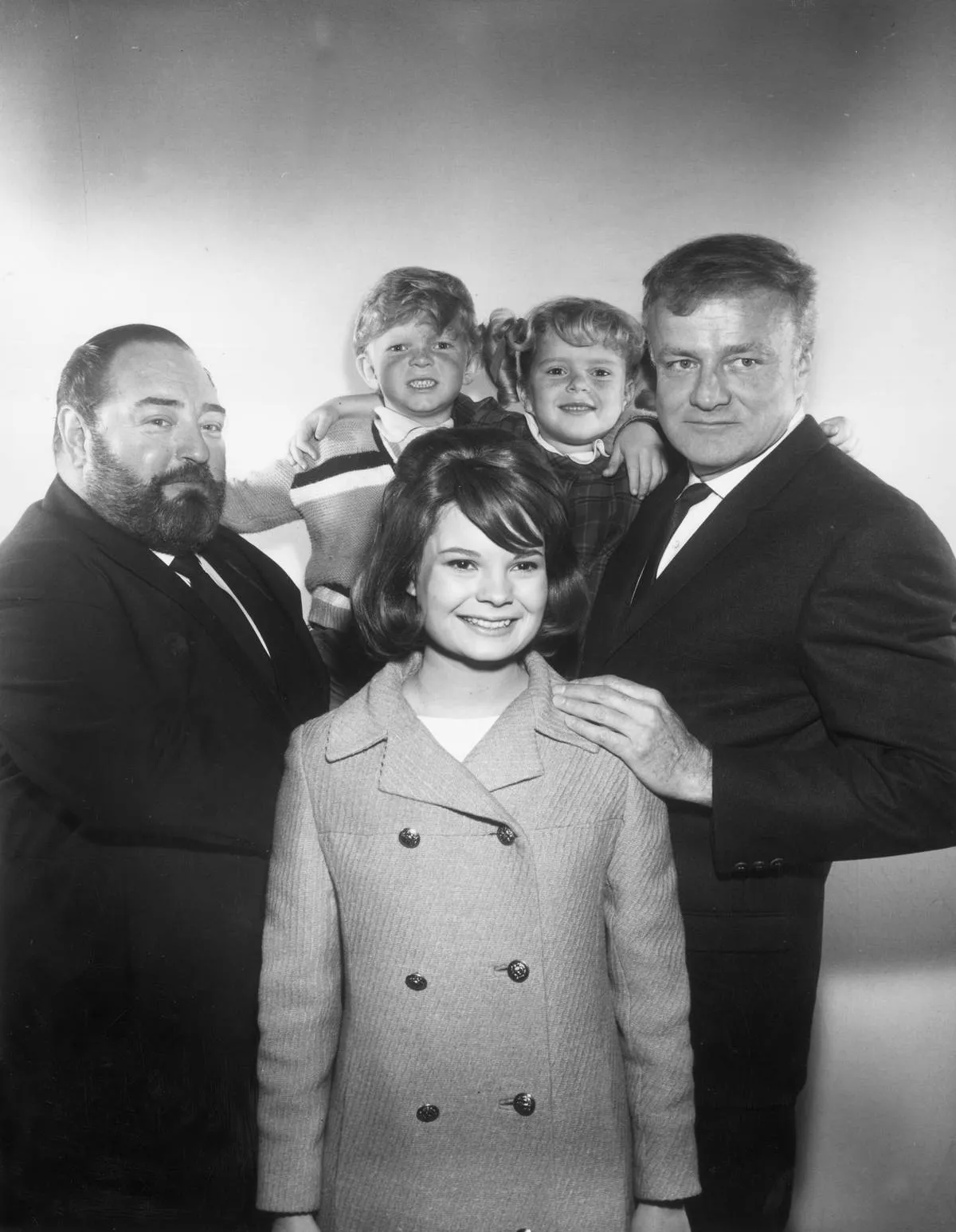 A promotional photo shows the cast of Family Affair.