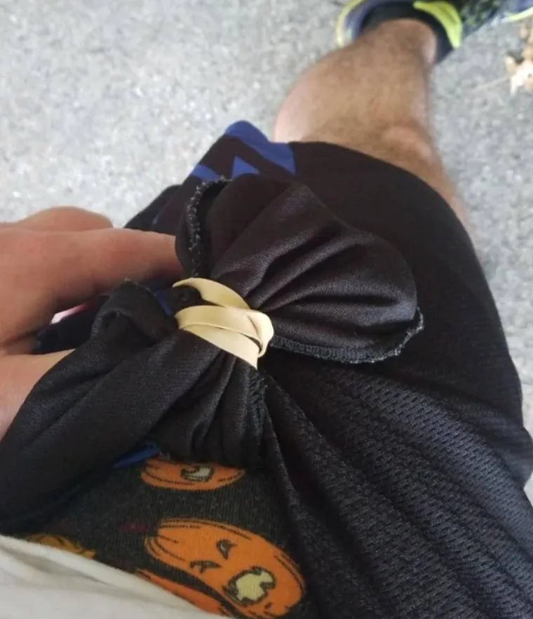 man tied rubberband around pocket from the inside