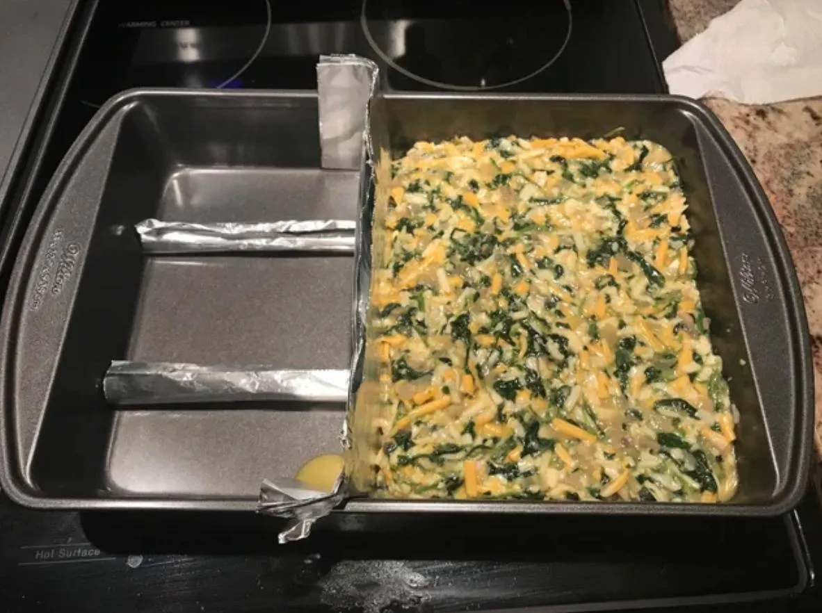person used a few strips of aluminum foil to push all of recipe into one side of the pan