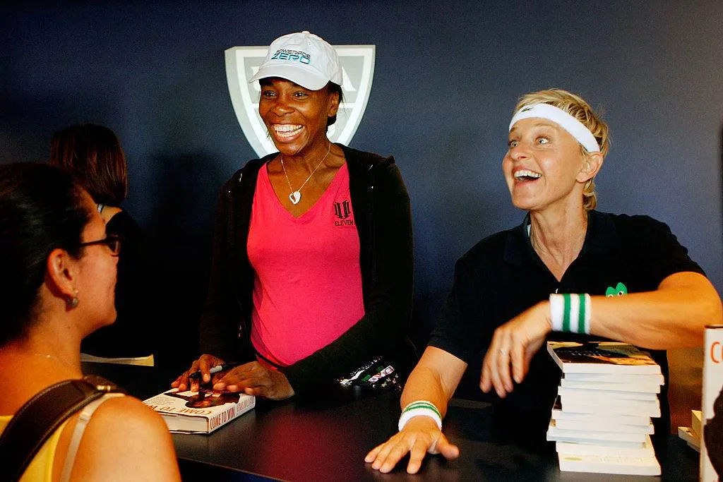 Ellen Degeneres (R) and Venus Williams share a laugh with a fan at Venus Williams' book signing 