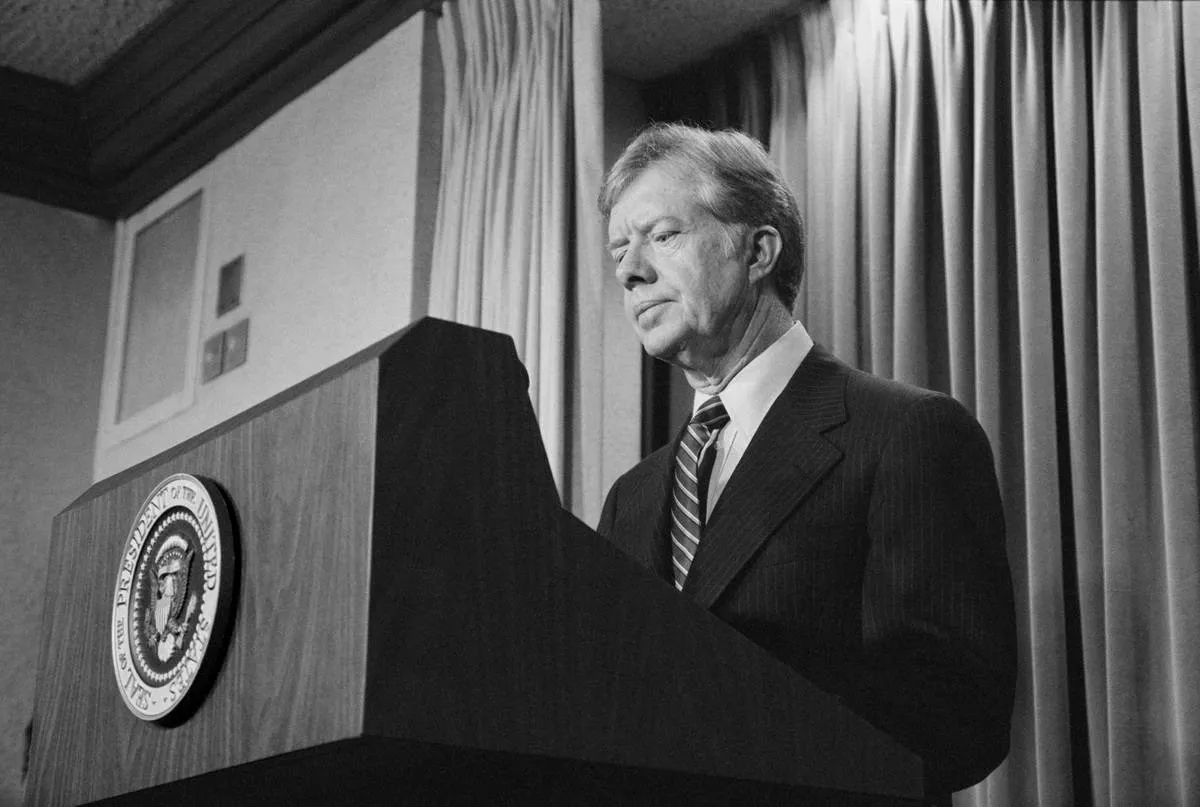 US President Jimmy Carter announces new sanctions against Iran in retaliation for taking US Hostages, Washington
