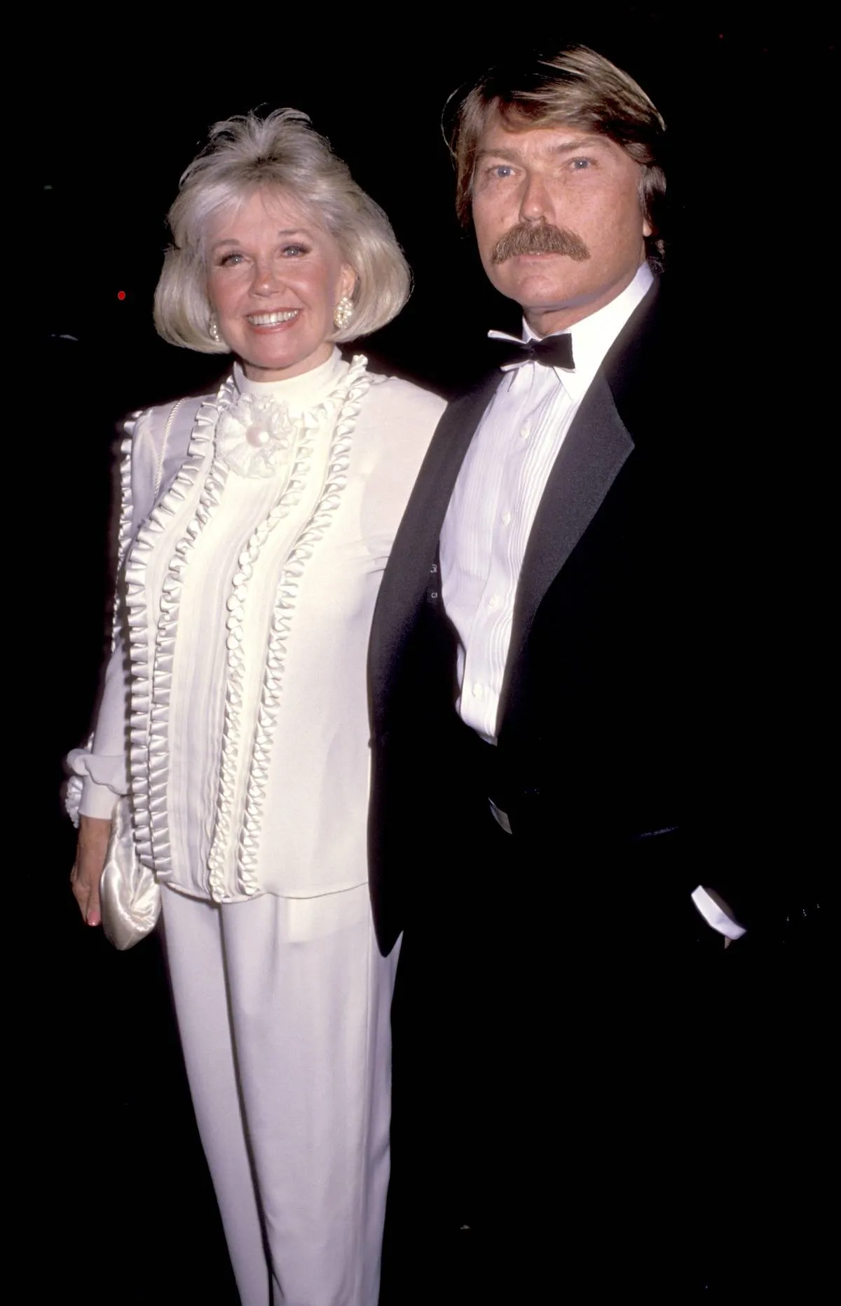 Doris Day and Terry Melcher pose for a photo together.