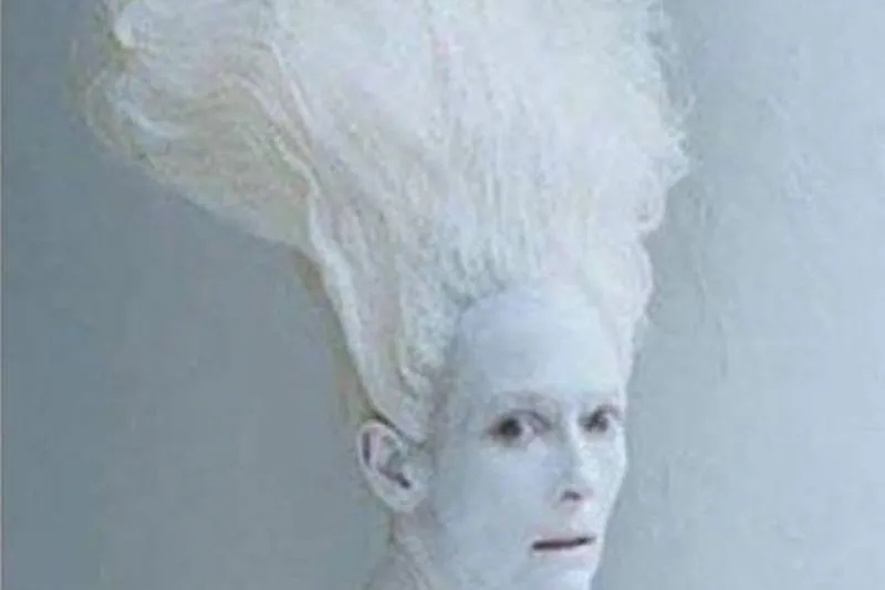 White painted face with frozen hair