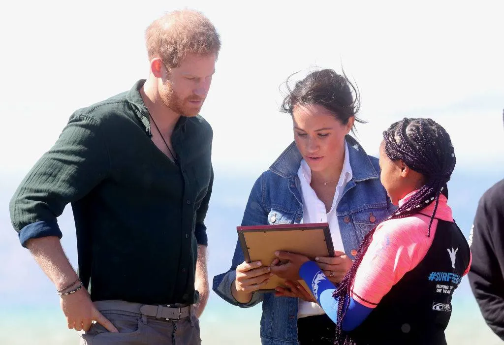 Prince Harry, Duke of Sussex and Meghan, Duchess of Sussex receive a gift 