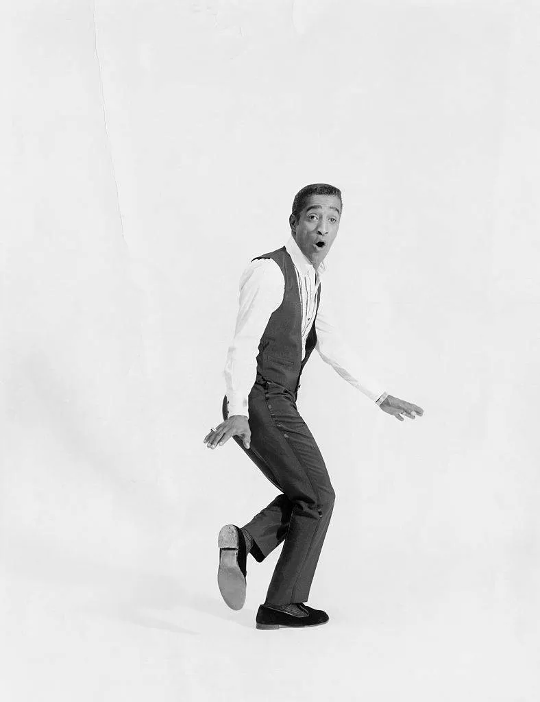 Studio portrait of entertainer Sammy Davis Jr. in mid-tap.