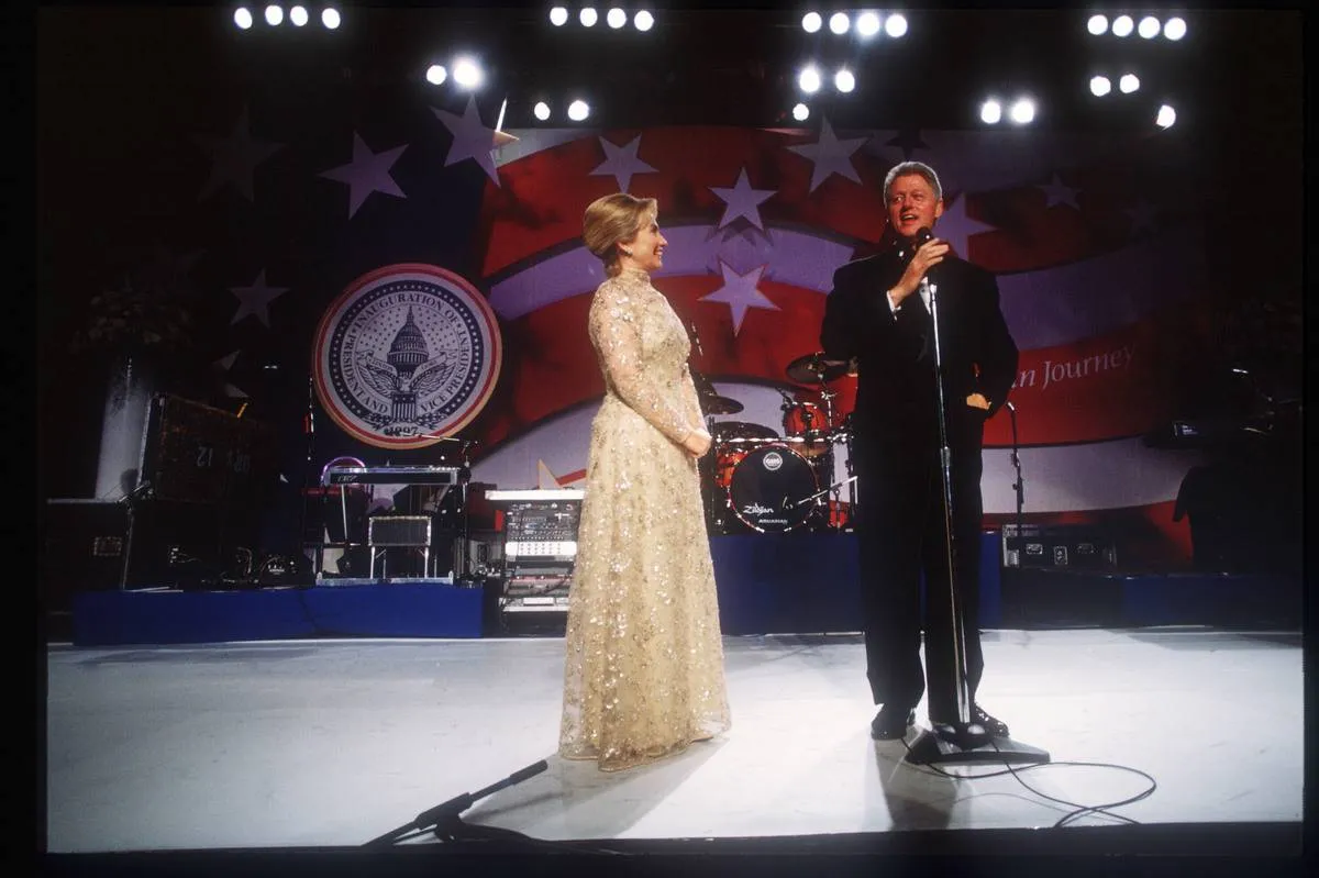 President Bill Clinton and wife Hillary stand at an inaugural ball.