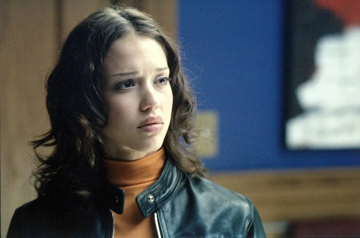 a girl wearing a leather jacket on dark angel