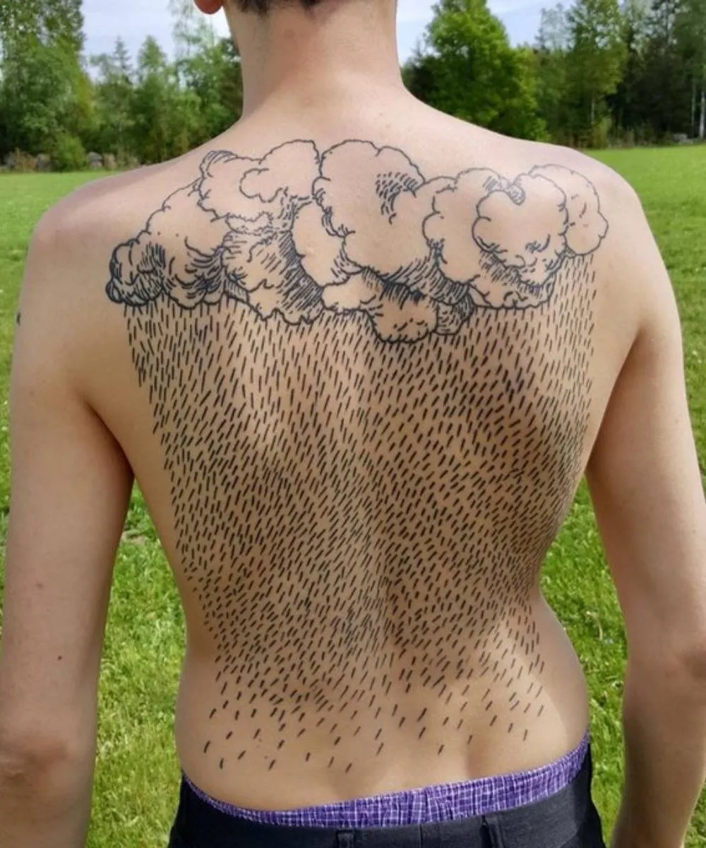 back tattoo of clouds and rain