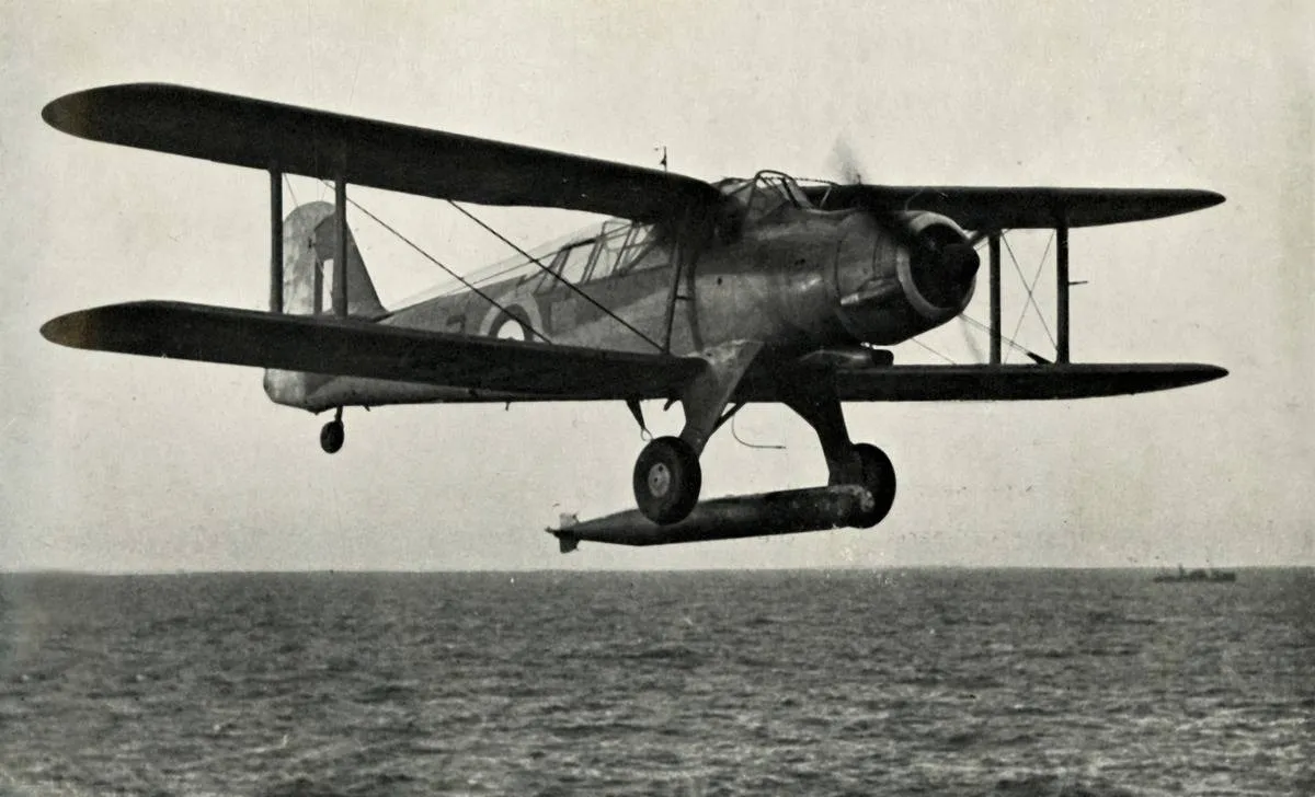 A Fairey Albacore flies over the ocean.