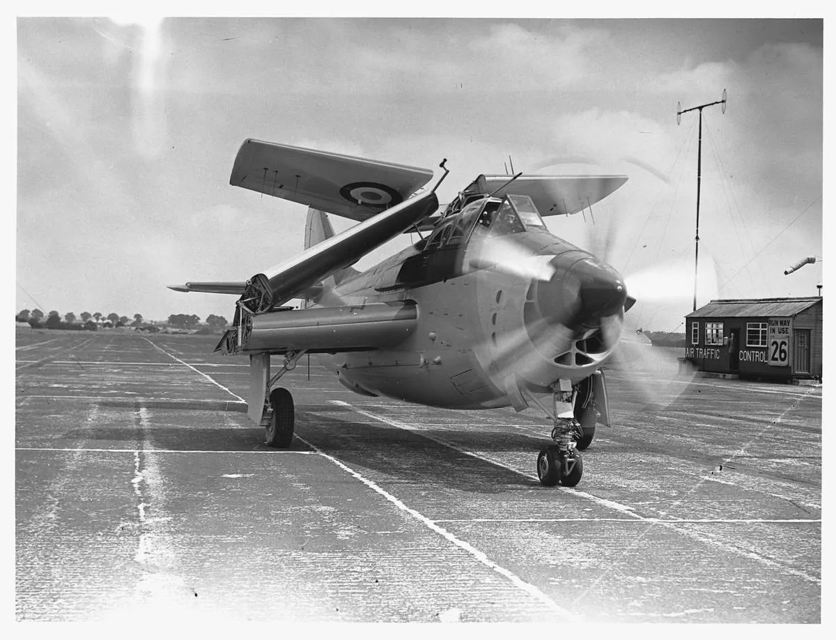 The Fairey Gannet lands and folds its wings.